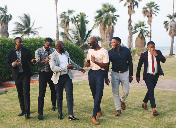 Six Men Standing While Laughing